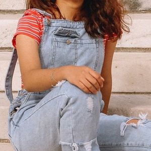 Distressed denim overalls